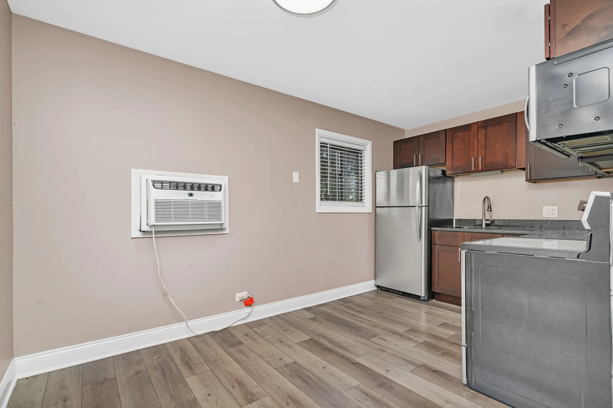 Renovated kitchen with espresso cabinetry at Lakeside Village